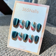 "Gilded Teal Cinnabar" – Deep Teal Cat Eye & Red-Blue Marble with Melting Gold Chrome Tip Oval Nails