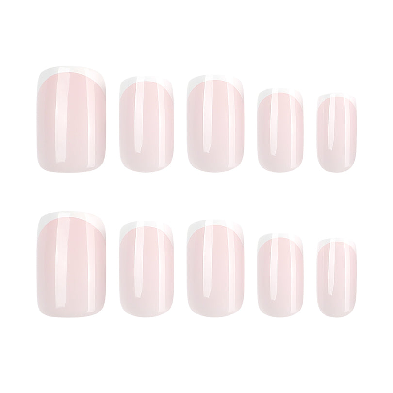 Five sizes of pale pink French tip press-on nails displayed in two rows