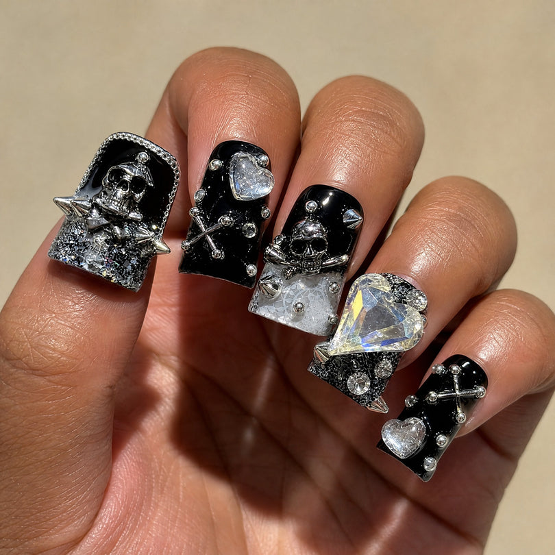 Gothic Skull Rebel square press on nails worn on a deep skin tone hand
