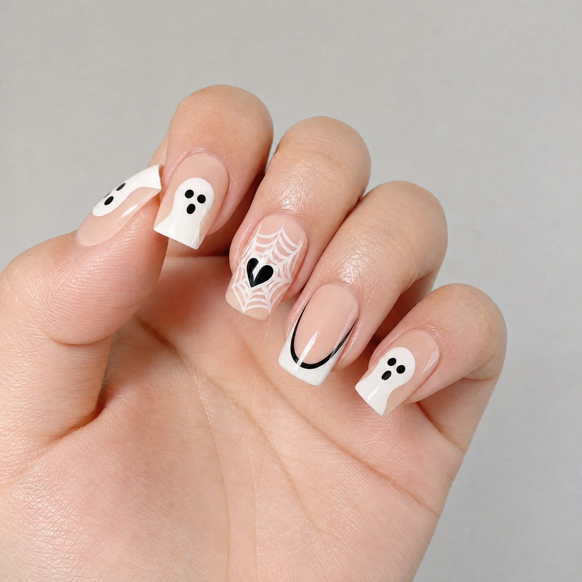 White French black edge ghost press on nails worn on hand