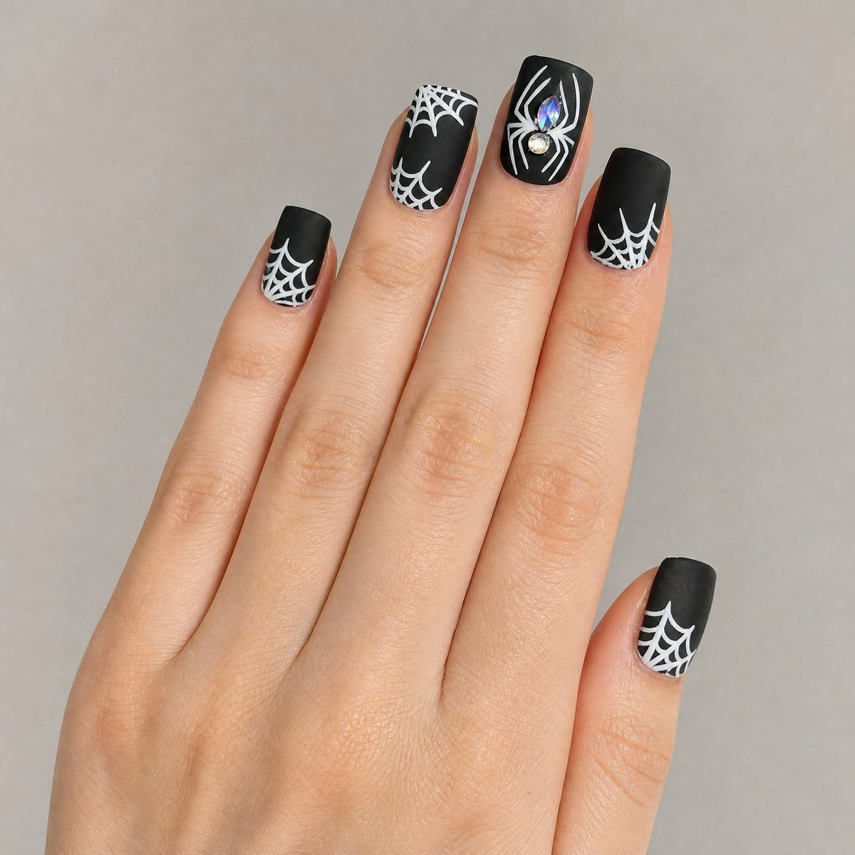 Black matte spider web press on nails worn on hand